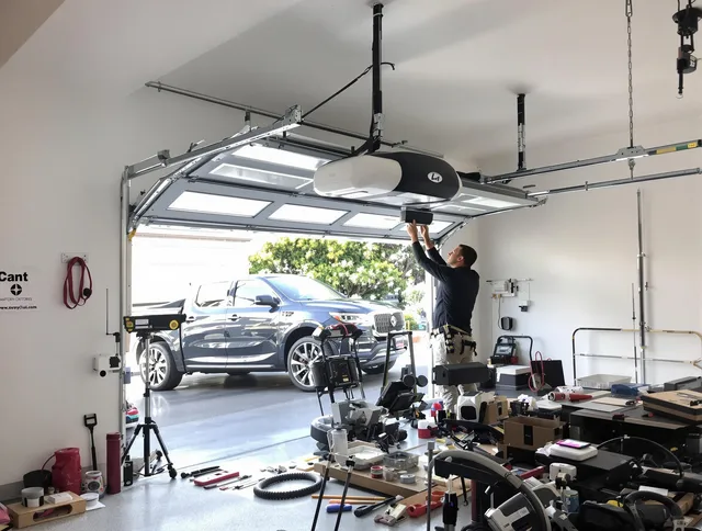Lake Elsinore Garage Door Repair specialist installing smart garage door opener system in Lake Elsinore home